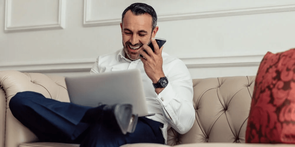 a man conducting hotel valuation preparation on a latpop