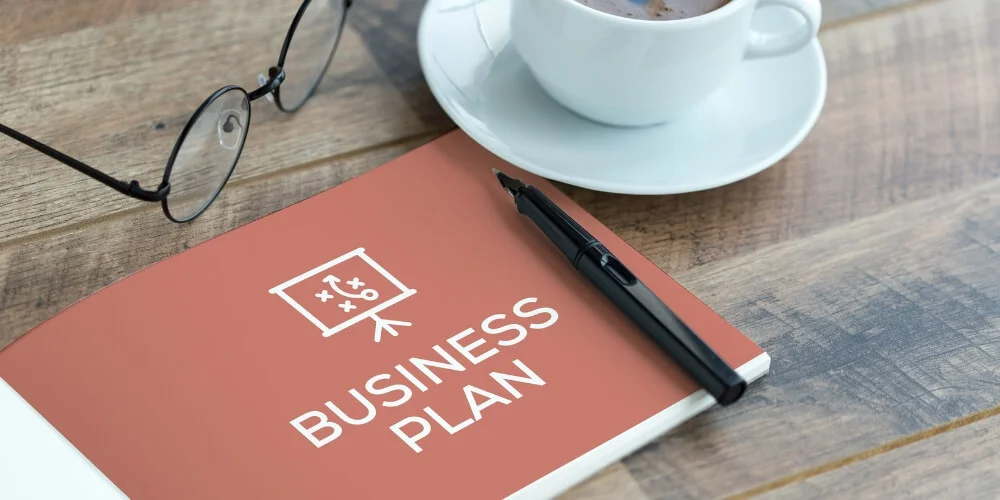 Business plan book with coffee